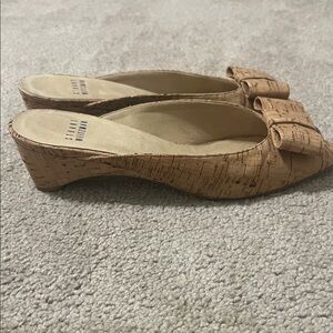 Stuart Weitzman cork peep-toe mule sandals featuring a decorative bow